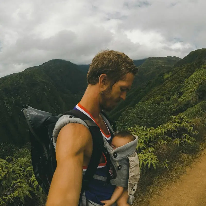 Dad hiking while baby naps in the carrier