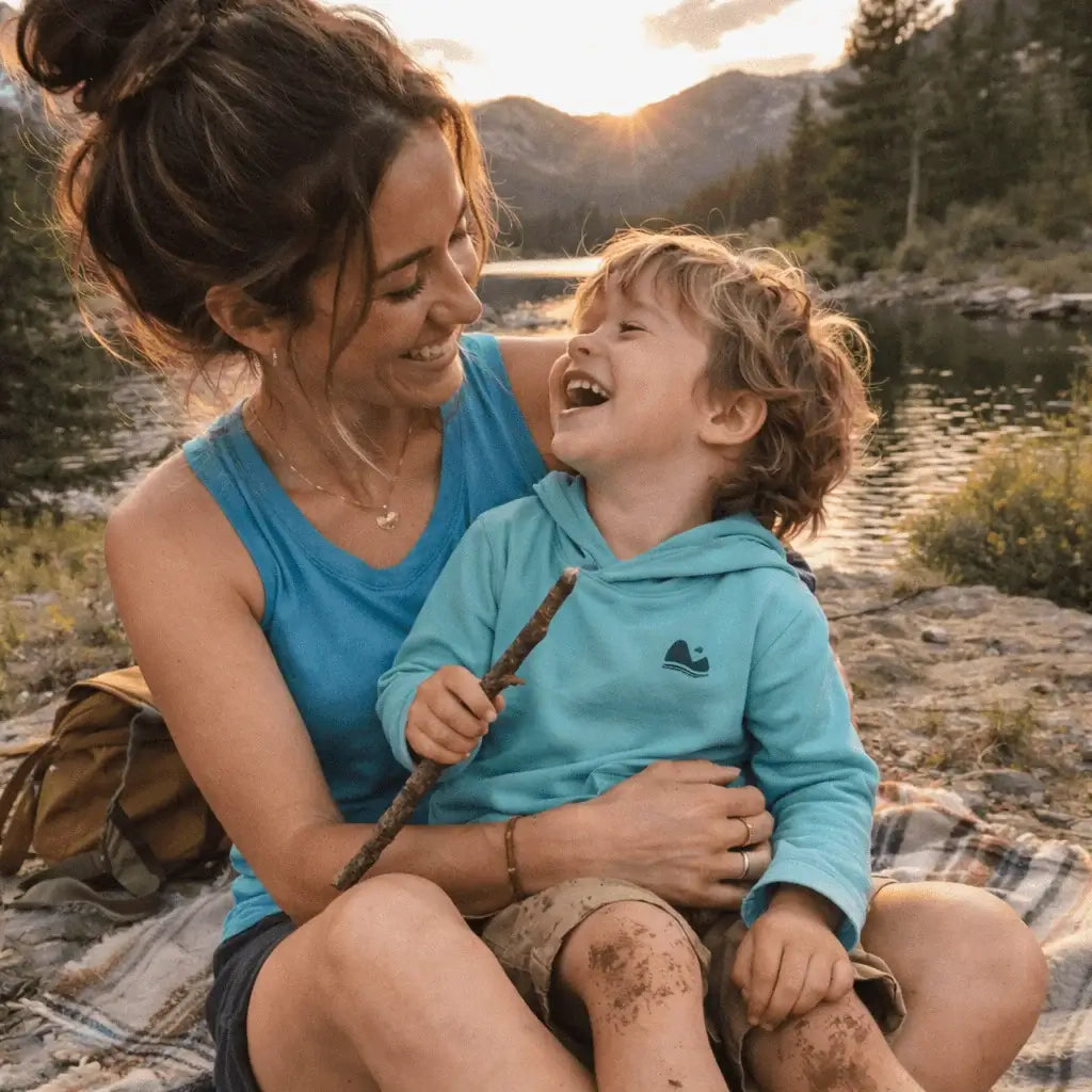 mom and son wearing Play Outside while playing in a creek