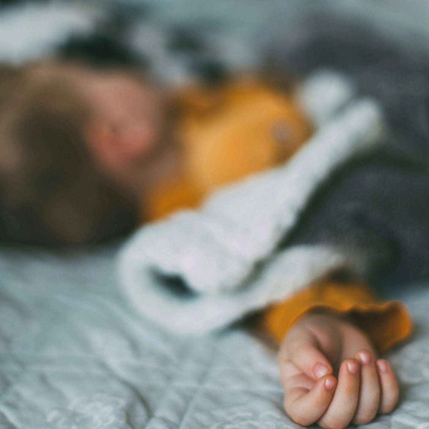 A child peacefully sleeping in bed after a day of outdoor adventure.