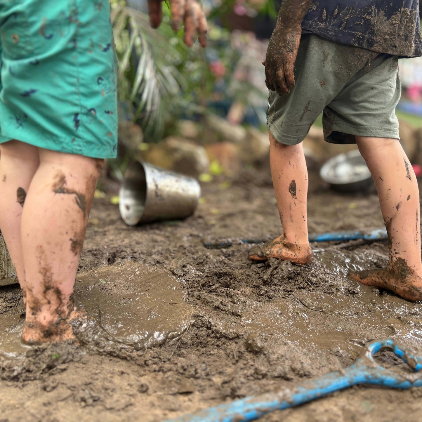 kids playing in the mud