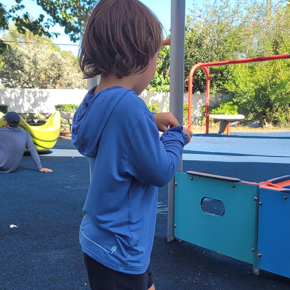 boy side view of the blue one bamboo sun shirt