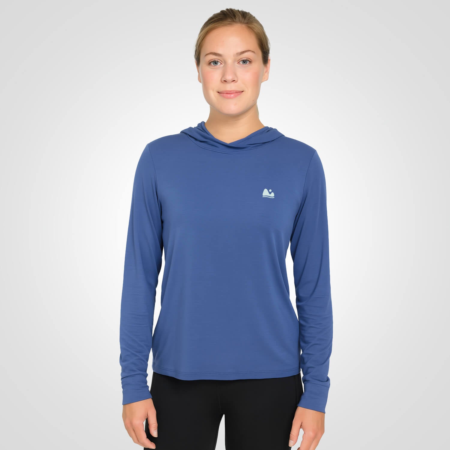 Woman wearing blue bamboo sun shirt UPF ONE shirt and base layer
