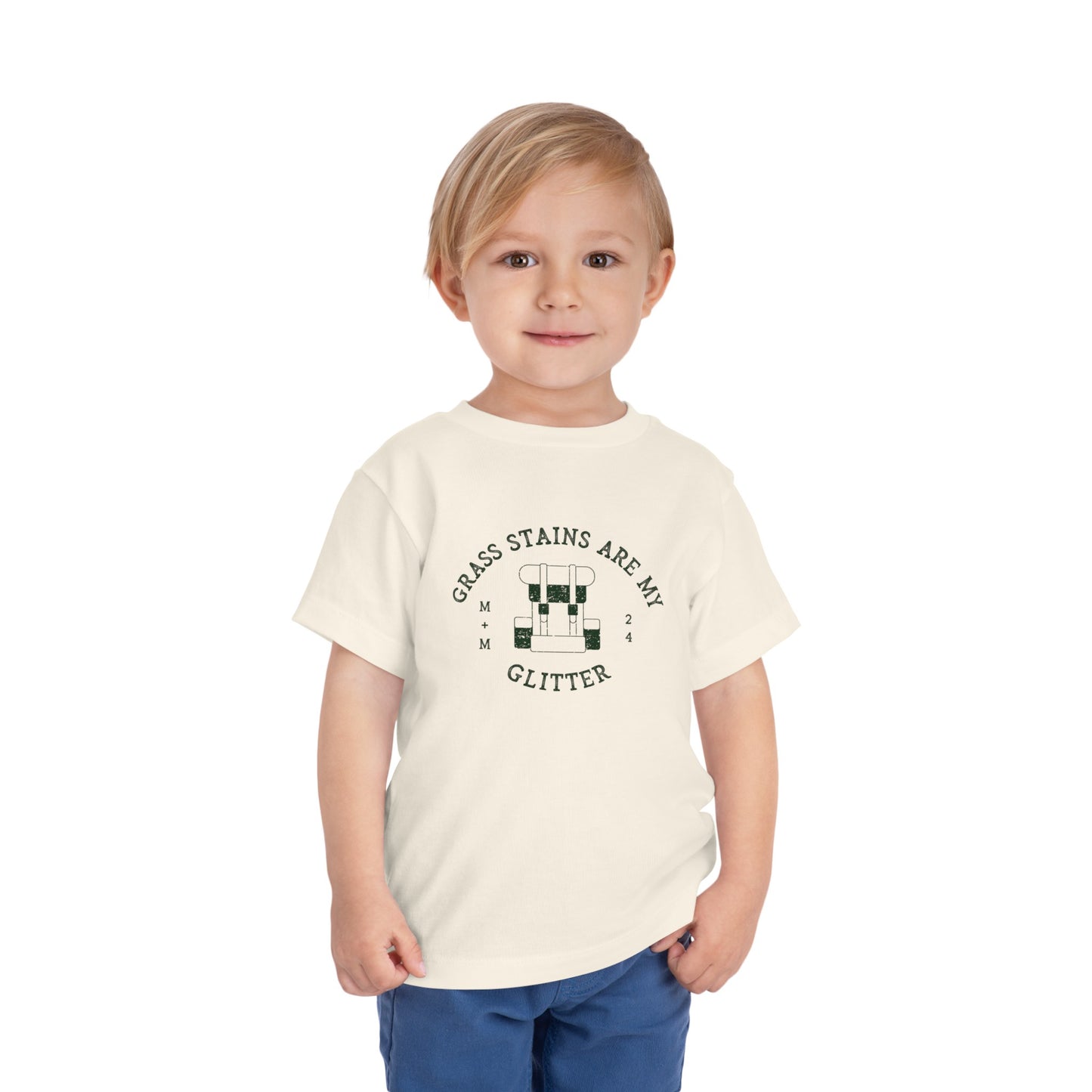 Toddler wearing Grass Stains are my glitter tee by Muddy + Mind