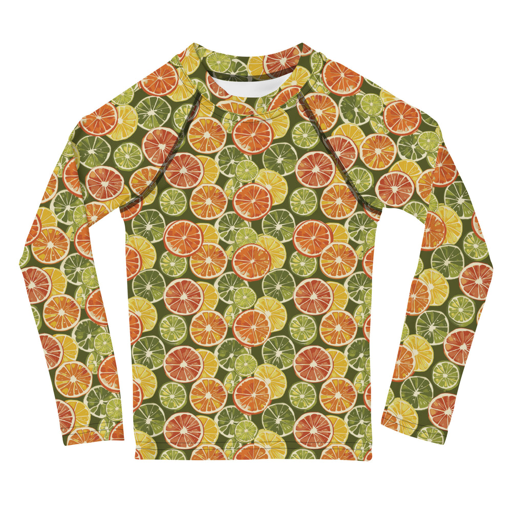 A vibrant citrus-themed rash guard for kids, featuring oranges and green leaves on a white background, shown from the front.