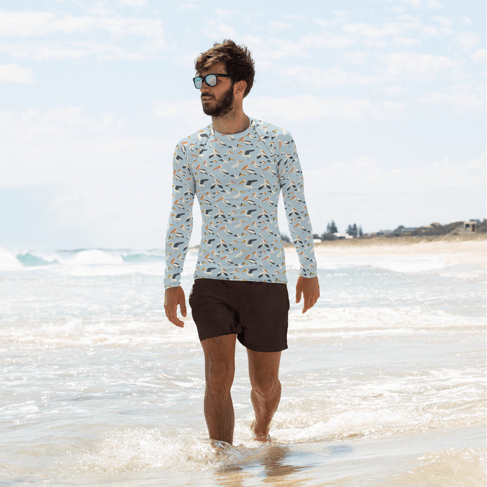 
                      
                        A long-sleeve pelican rash guard for men, featuring breathable fabric and a fun bird design for beach adventures.
                      
                    