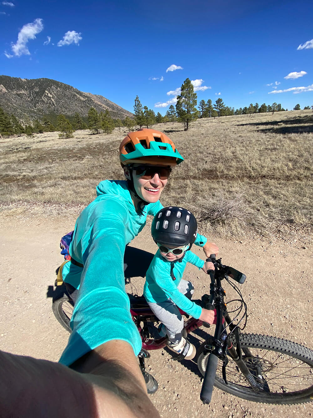 twin girls matching in their aqua bamboo sun shirts