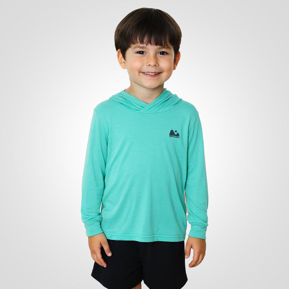 
                      
                        a boy wearing the sun protecting aqua bamboo sun shirt and base layer
                      
                    