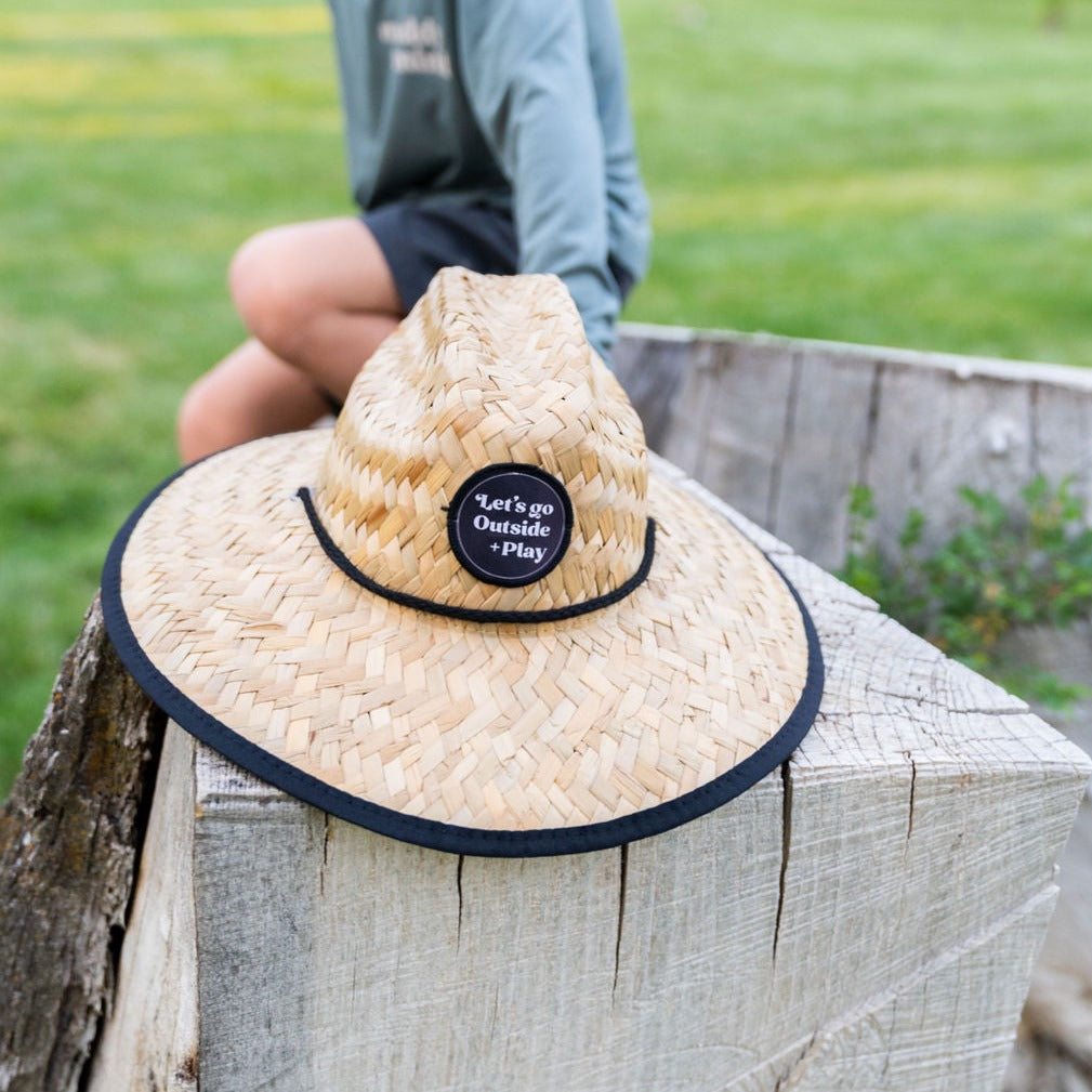 Muddy + Mind Kids Beach Comber Straw Hat, featuring a wide brim and breathable straw material for stylish sun protection during outdoor adventures.