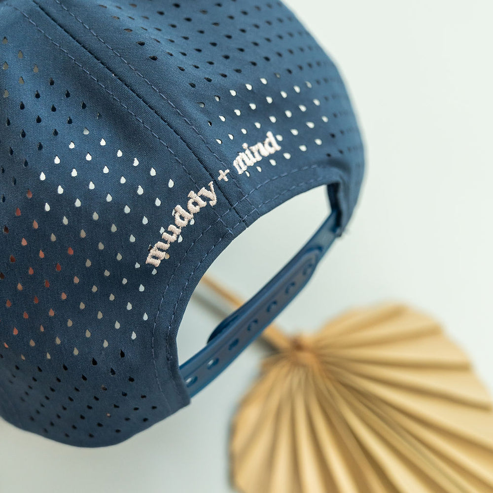 
                      
                        Back view of the Kids Snapback Hat, showing adjustable snapback closure for growing kids by Muddy + Mind.
                      
                    