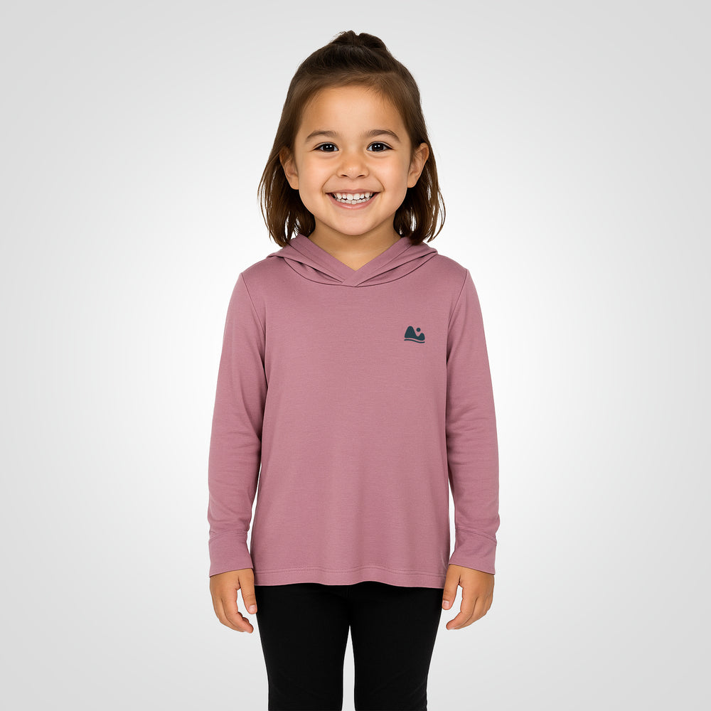 
                      
                        a girl wearing the sun protecting pink bamboo sun shirt and base layer
                      
                    