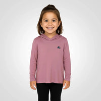 a girl wearing the sun protecting pink bamboo sun shirt and base layer