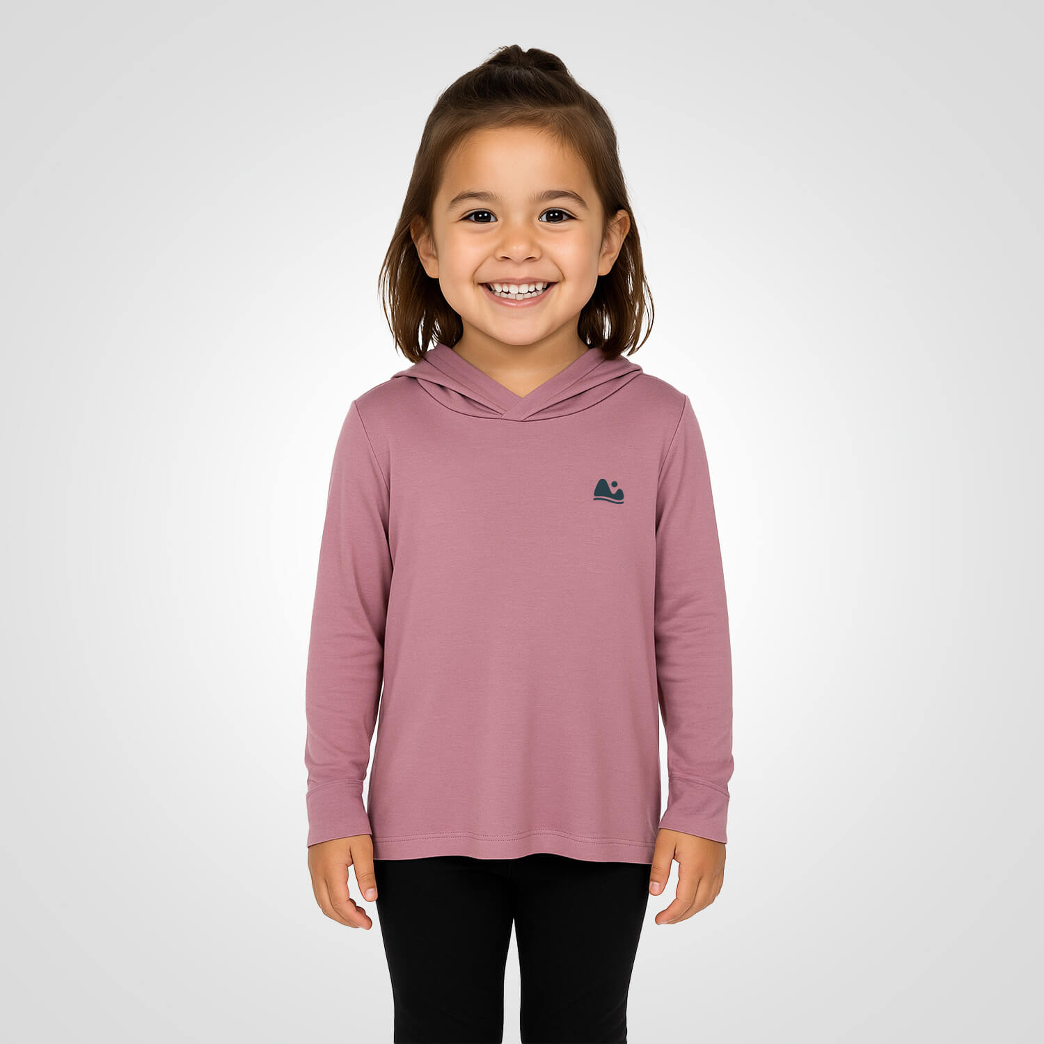 a girl wearing the sun protecting pink bamboo sun shirt and base layer