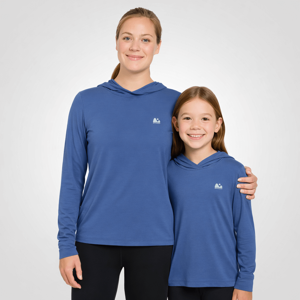 Mom and kid matching in their ONE bamboo sun shirt in blue