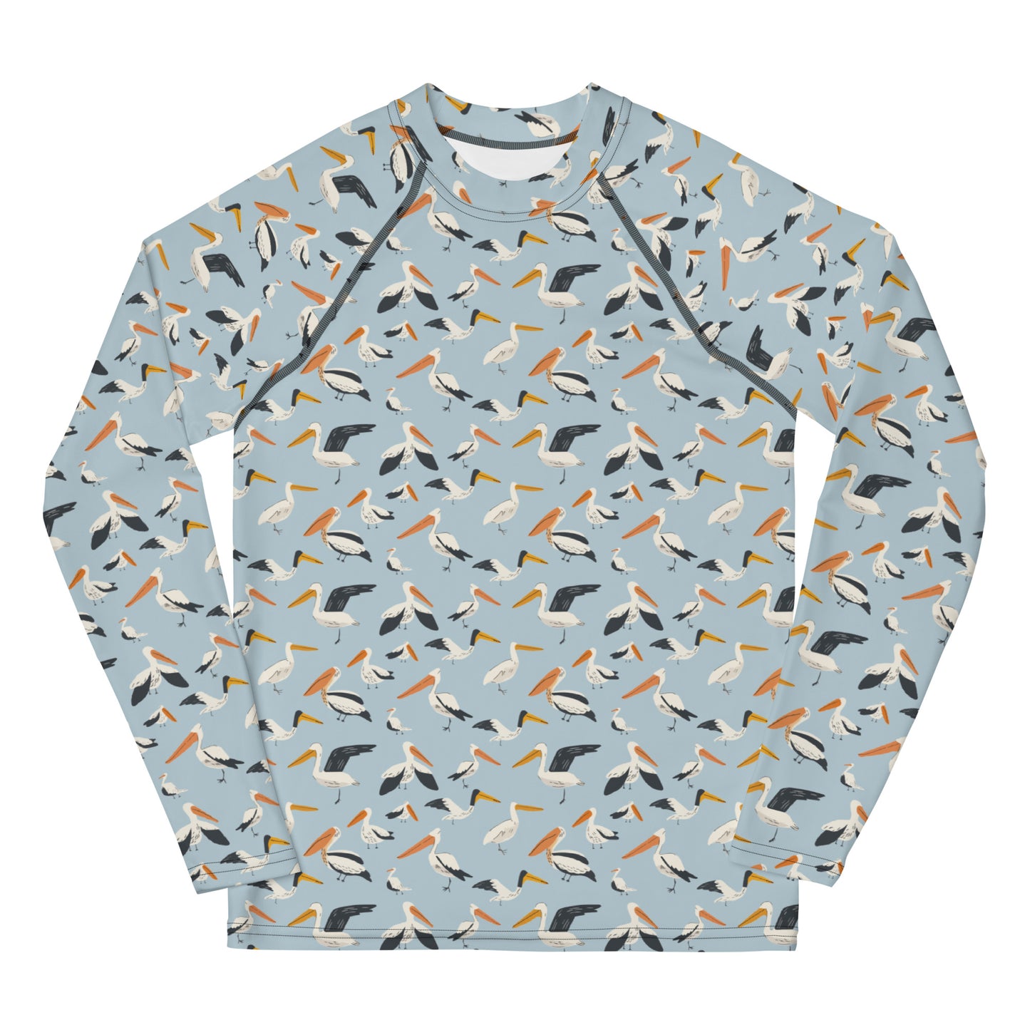 A teen’s rash guard featuring a playful pelican print with shades of blue and white, shown from the front.