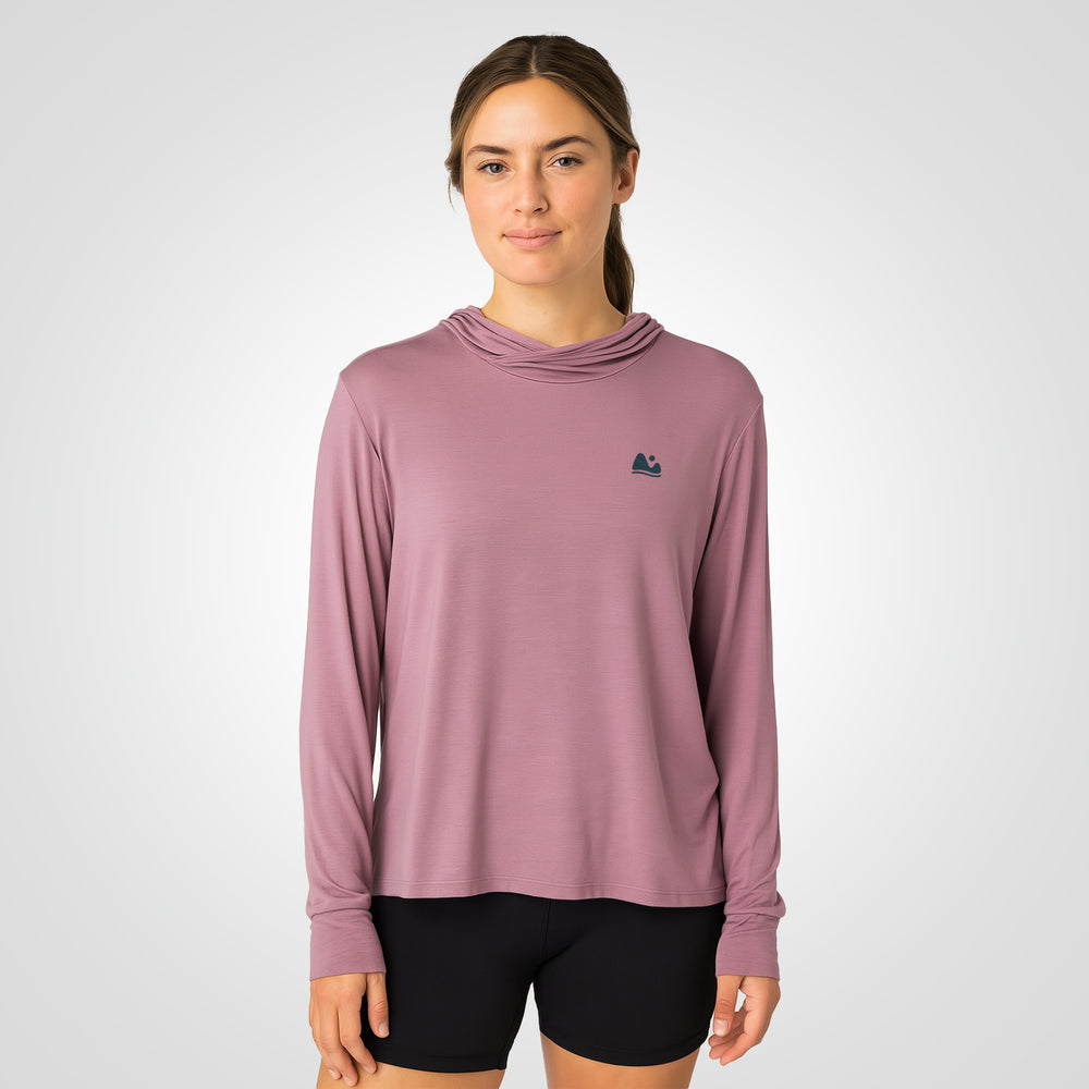 Woman wearing pink bamboo sun shirt UPF ONE shirt and base layer