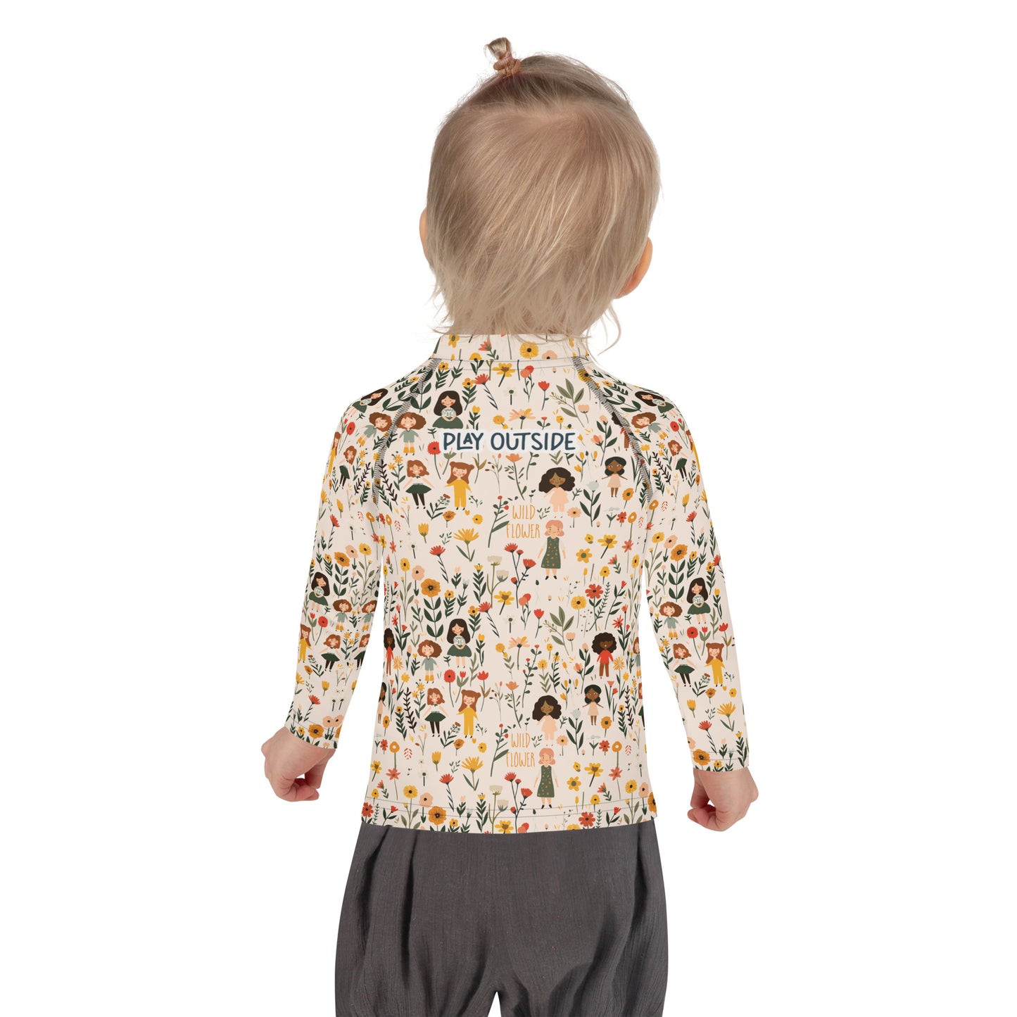 A flat lay of a wildflower-themed rash guard, showcasing the intricate floral and girls pattern from the back.

